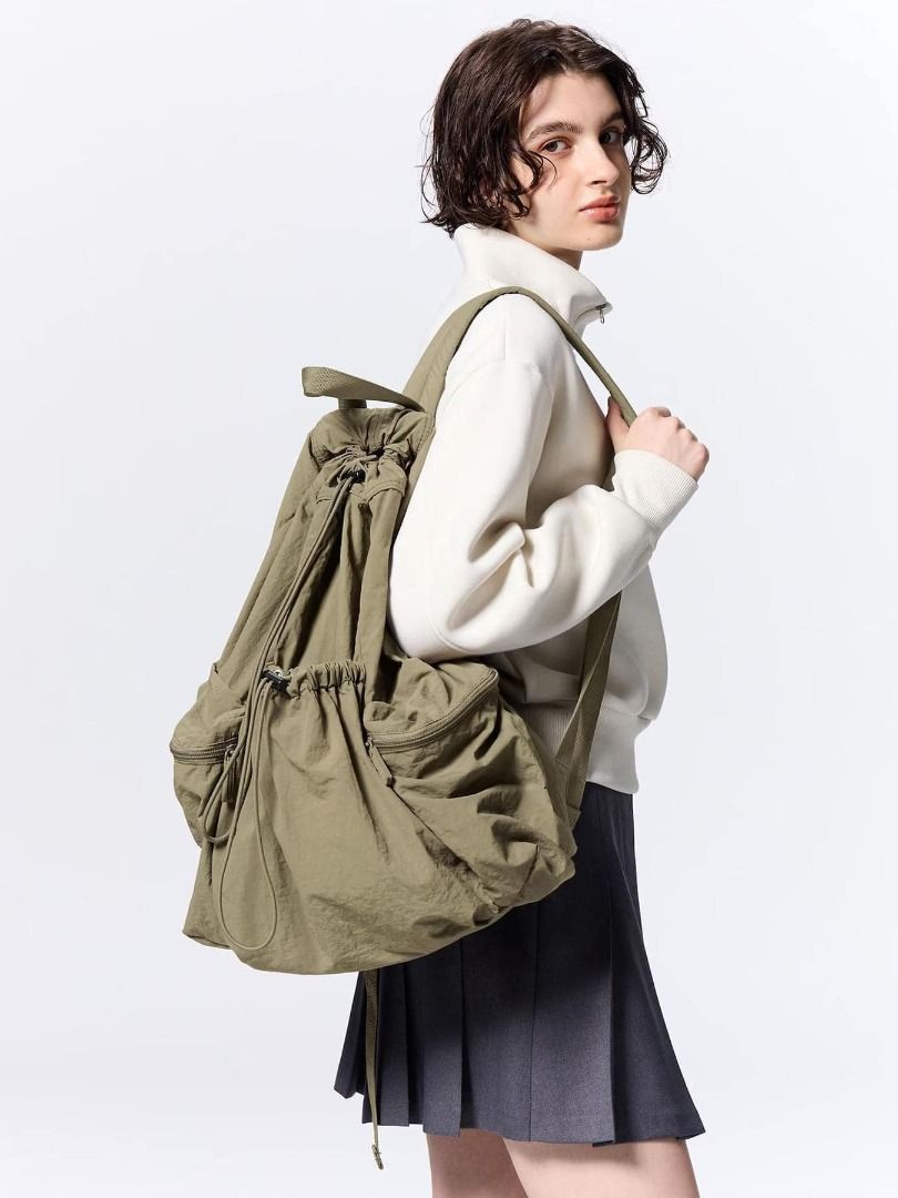 GU - Soft Nylon Drawstring Backpack (Category: Backpacks) located in Pasig City. Submitted by nix_21 (Listing ID 1345428087, Image 1). Description: 💡 Details: 🔸 Colors: Black (available) & Olive (sold) 🔸 Price: ₱1,250 (on-hand, PH) 📏 Size: Length: 49 cm Width (Bottom): 29 cm Depth: 15 cm Handle (Rise): 11.5 cm Weight: 310 g 📸 Features: Soft nylon exterior with a natural surface texture. Padded back and shoulder straps for a comfortable fit. 