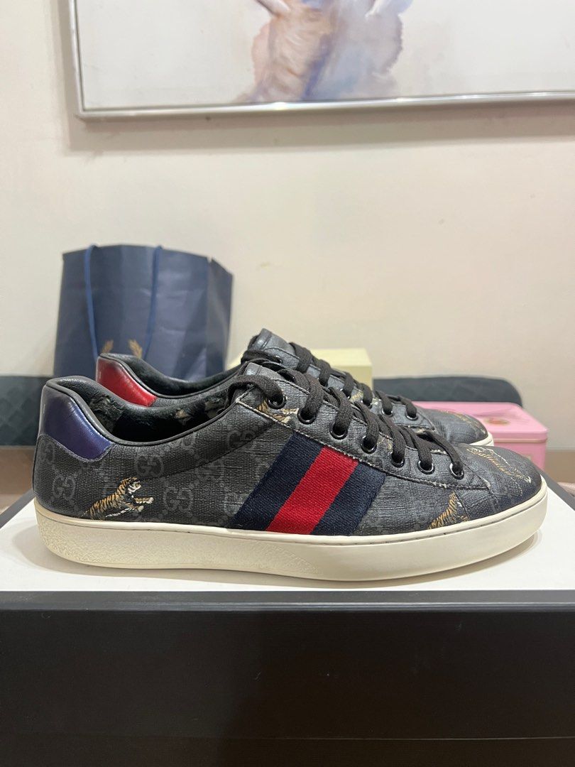 Gucci Ace Sneaker GG Supreme Tiger (Category: Sneakers) located in Quezon City. Submitted by scar.alta (Listing ID 1345451599, Image 2). Description: Gucci Ace Sneaker GG Supreme Tiger - Not common pair - Used but in good condition - Size 7.5 UK / 41.5 EU / 8 US - Comes with original packaging (dustbags, extra shoelace, paper inserts) .