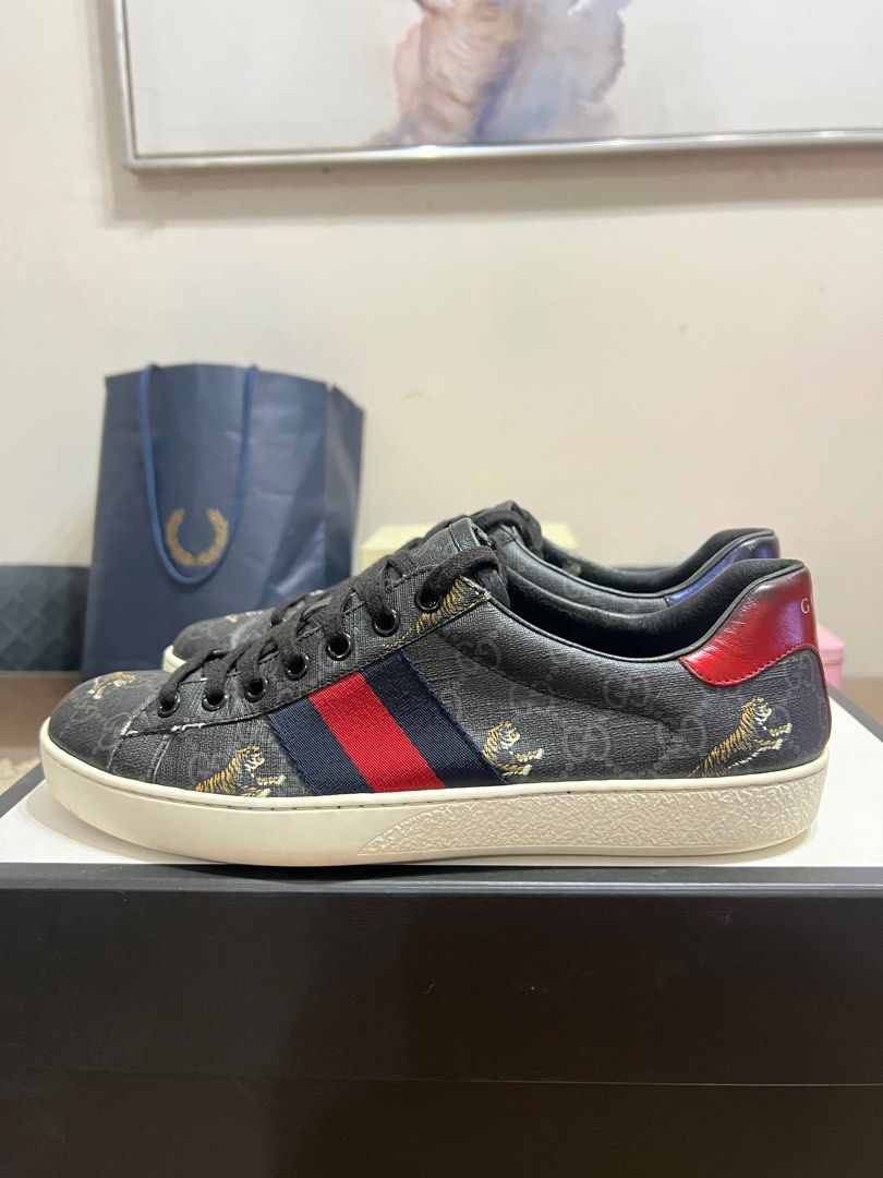 Gucci Ace Sneaker GG Supreme Tiger (Category: Sneakers) located in Quezon City. Submitted by scar.alta (Listing ID 1345451599, Image 3). Description: Gucci Ace Sneaker GG Supreme Tiger - Not common pair - Used but in good condition - Size 7.5 UK / 41.5 EU / 8 US - Comes with original packaging (dustbags, extra shoelace, paper inserts) .