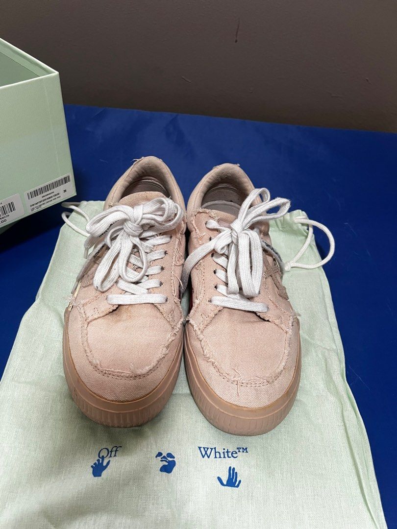 Off White Low Vulcanized Canvas Sneakers (Category: Sneakers) located in Quezon City. Submitted by decluttering25 (Listing ID 1345303315, Image 3). Description: Item in good condition 8/10 With shoe bag and box Negotiable.