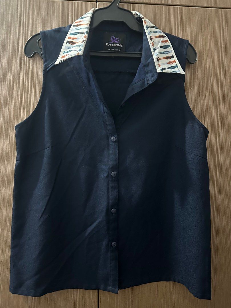 Plains and Prints Sleeveless top (Category: Sleeveless) located in Manila. Submitted by jamesgmd (Listing ID 1345483630, Image 1). Description: Collar with cat design All working buttons Original price at 1k plus .