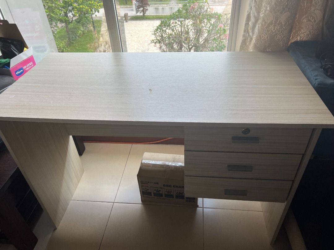 Study Table (Category: Tables & Sets) located in Singapore. Submitted by maninair999 (Listing ID 1345333663, Image 2). Description: - 150 cm * 60 cm - The tabletop has markings from using it and some inconspicuous scratches at the edges. Otherwise, the table is strong and sturdy. Easy to wipe and maintain. Table can be configurable between a study table and a computer table. - self-collect near Teban Garden 600022.