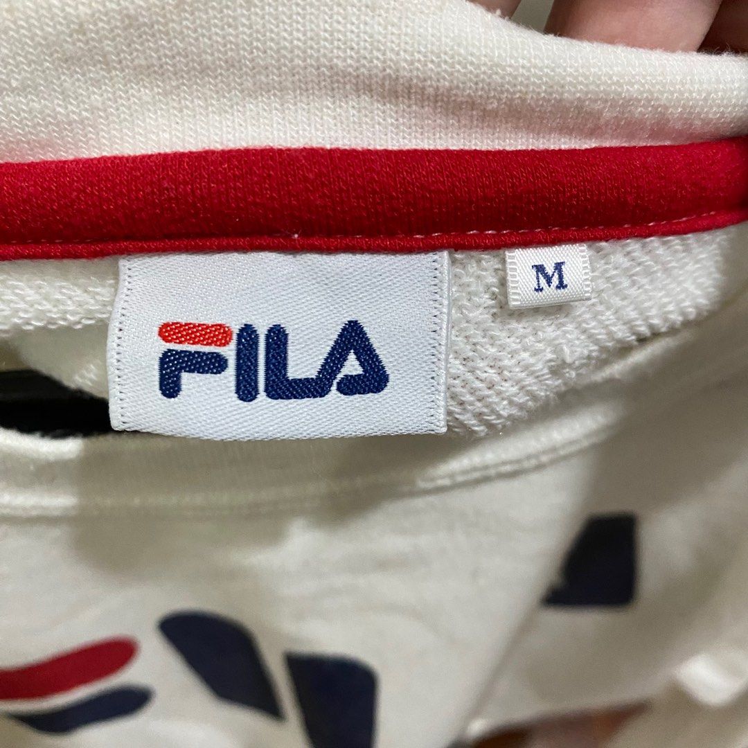 White FILA Sweatshirt (Category: Longsleeves) located in Antipolo. Submitted by de.klutter (Listing ID 1345403658, Image 3). Description: White FILA Sporty Cropped Sweatshirt / Jumper - Size: Women’s Medium CONDITION: Pre-loved, 7/10. Has a few bleach marks on the sleeve stripes on one sleeve (see photo) RFS: Decluttering PM for additional pics/info!.