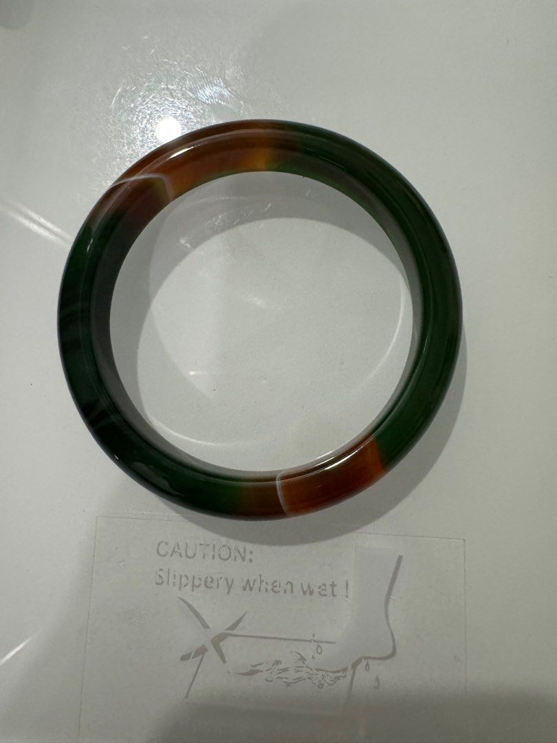 Agate Bangle (Category: Body Jewelry) located in Petaling Jaya. Submitted by liyan20 (Listing ID 1345693909, Image 1). Description: Green mix Yellow Brown Agate Bangle 009 Size 56.5mm showcasing unique patterns and a refreshing green hue. Known for its calming and balancing properties, agate is a beautiful and healing gemstone. The bangle is a perfect blend of elegance and wellness, ideal for daily wear or special occasions. got certificate card.