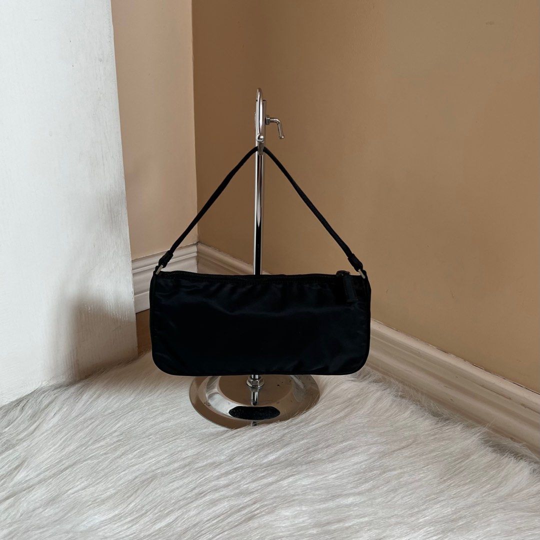 Authentic Preloved Prada Nylon Pochette Shoulder Bag Black with Silver Hardware (Category: Luxury Bags & Wallets) located in Quezon City. Submitted by tokyoluxestuff2013 (Listing ID 1345665091, Image 3). Description: LOWBALLERS WILL NOT BE ENTERTAINED 🚫 100% Guaranteed Authentic Excellent condition No inclusion Approx. 24cm W x 12cm H Onhand Shipping via LBC/Grab/Lalamove Add shipping fee No haggling No swapping Serious buyer only.