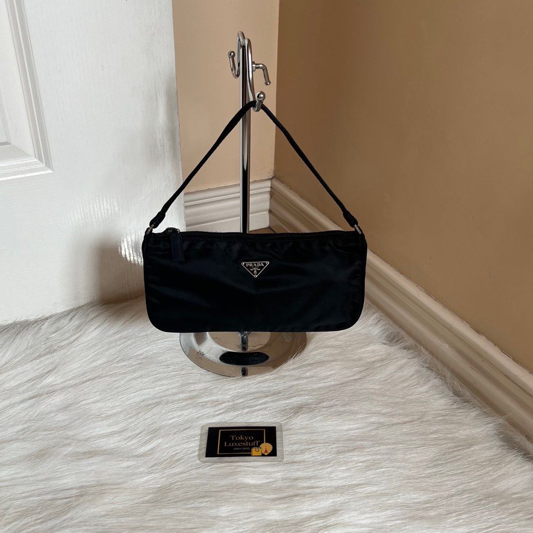 Authentic Preloved Prada Nylon Pochette Shoulder Bag Black with Silver Hardware (Category: Luxury Bags & Wallets) located in Quezon City. Submitted by tokyoluxestuff2013 (Listing ID 1345665091, Image 1). Description: LOWBALLERS WILL NOT BE ENTERTAINED 🚫 100% Guaranteed Authentic Excellent condition No inclusion Approx. 24cm W x 12cm H Onhand Shipping via LBC/Grab/Lalamove Add shipping fee No haggling No swapping Serious buyer only.