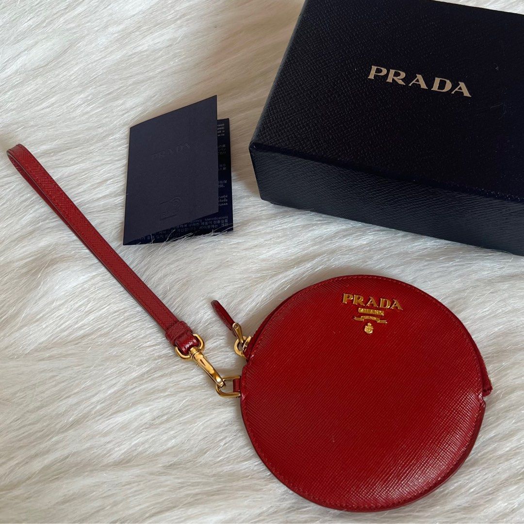 Authentic Preloved Prada Saffiano Round Wristlet with Gold Hardware (Category: Luxury Bags & Wallets) located in Quezon City. Submitted by tokyoluxestuff2013 (Listing ID 1345603370, Image 1). Description: LOWBALLERS WILL NOT BE ENTERTAINED 🚫 100% Guaranteed Authentic Comes with care card and box Excellent condition No discoloration Clean inside and out Onhand Shipping via LBC/Grab/Lalamove Add shipping fee No haggling No swapping Serious buyer o