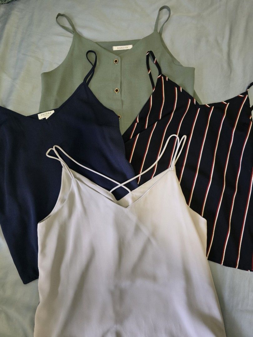 Basic Cami Tops (Category: Sleeveless) located in Singapore. Submitted by kimberbueno (Listing ID 1345586467, Image 1). Description: 1. YFS Criss Cross Back Cami Top in Ice Blue 2. Zalora Basics Navy Blue Cami Top (Size M) (SOLD) 3. Zalora Basics Blue Striped Cami Top (Size M) 4. Xiaolujia (Bugis Street) Sage Button Cami Top (SOLD) All suitable for UK10! 1 for $5 All for $15.