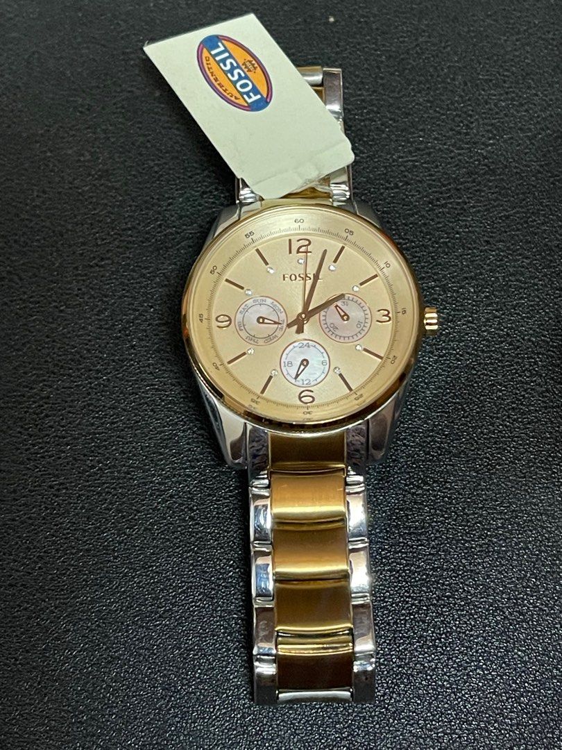 Fossil two-tone rose gold stainless watch (Category: Women's Watches) located in Makati City. Submitted by chie_sells (Listing ID 1345508672, Image 2). Description: Authentic Fossil BQ 1404 Rose Gold & Stainless Bracelet Swarovski Crystal Face Markers Minor scratches and signs of usage. Still in good working condition. With original box and tag. Removed the battery to avoid leakage. RFS: not using just stored away..