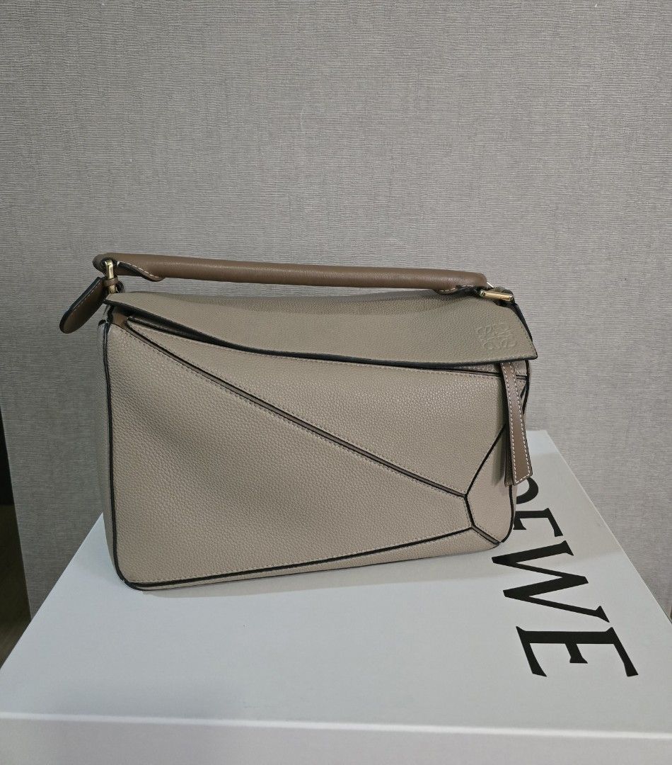 Loewe Puzzle Bag Bi-color Medium (Category: Luxury Bags & Wallets) located in Quezon City. Submitted by asoonie (Listing ID 1345583787, Image 1). Description: Color: Sand/Mink Bi Color Size: Medium Includes: Box, Dust Bag and Bag Organizer RFS: Decluttering Shipping c/o buyer.