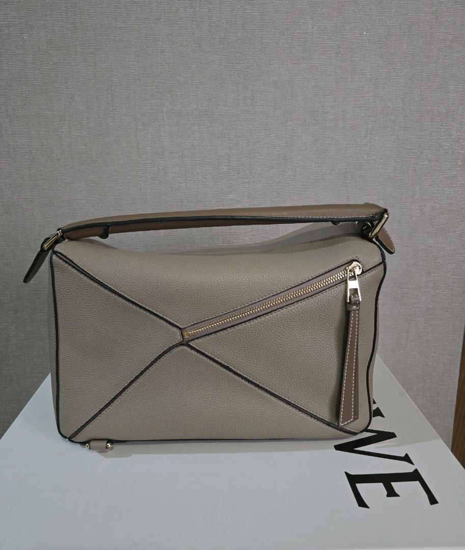 Loewe Puzzle Bag Bi-color Medium (Category: Luxury Bags & Wallets) located in Quezon City. Submitted by asoonie (Listing ID 1345583787, Image 2). Description: Color: Sand/Mink Bi Color Size: Medium Includes: Box, Dust Bag and Bag Organizer RFS: Decluttering Shipping c/o buyer.