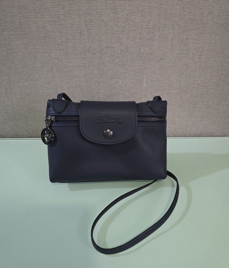 Longchamp Le Pilage Xtra Cross Body Bag (Category: Cross-body Bags) located in Quezon City. Submitted by asoonie (Listing ID 1345587248, Image 1). Description: Le Pilage Xtra Cross Body Bag in Navy Blue. Material: Cowhide Leather Includes: Care Card and Dust Bag Bought in Hong Kong RFS: Decluttering.
