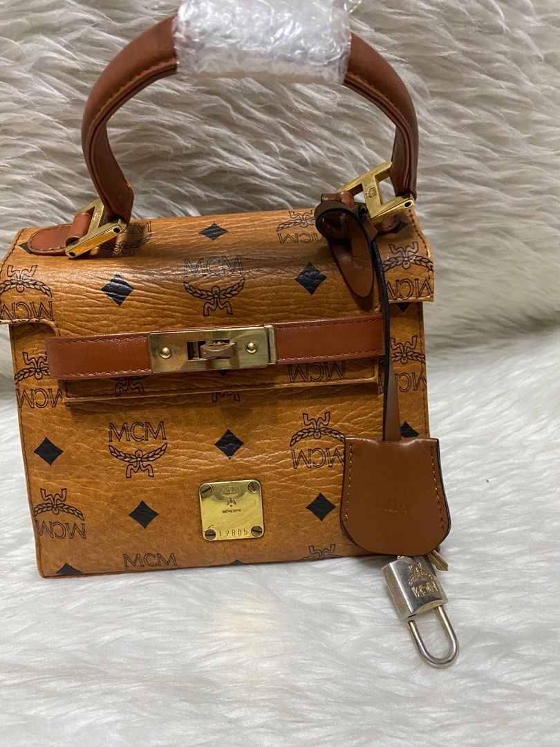 MCM mini Kelly bag Authetic (Category: Luxury Bags & Wallets) located in Malolos. Submitted by yamaguchionline (Listing ID 1345588647, Image 1). Description: Bought in Japan guaranteed authentic money back if proven fake.very nice in actual.please respect my ads.