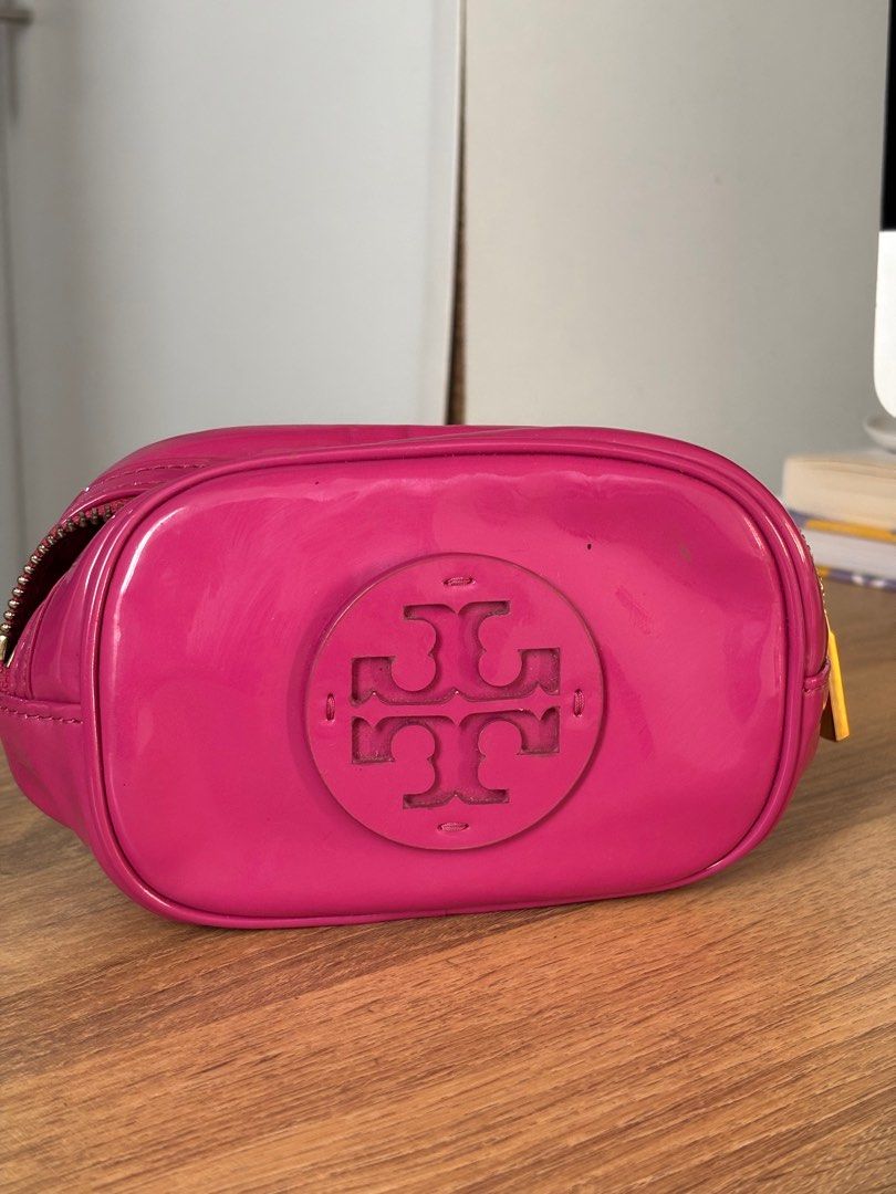 Tory Burch Small Cosmetic Bag (Category: Luxury Bags & Wallets) located in Las Pinas. Submitted by eggspresso (Listing ID 1345684187, Image 1). Description: Small cosmetic bag in barbie pink (shade may seem a bit lighter in person due to to lighting) Has a small stain on zipper and minor scratches in front Small but spacious can fit a 50ml perfume and more Authentic bought in USA.