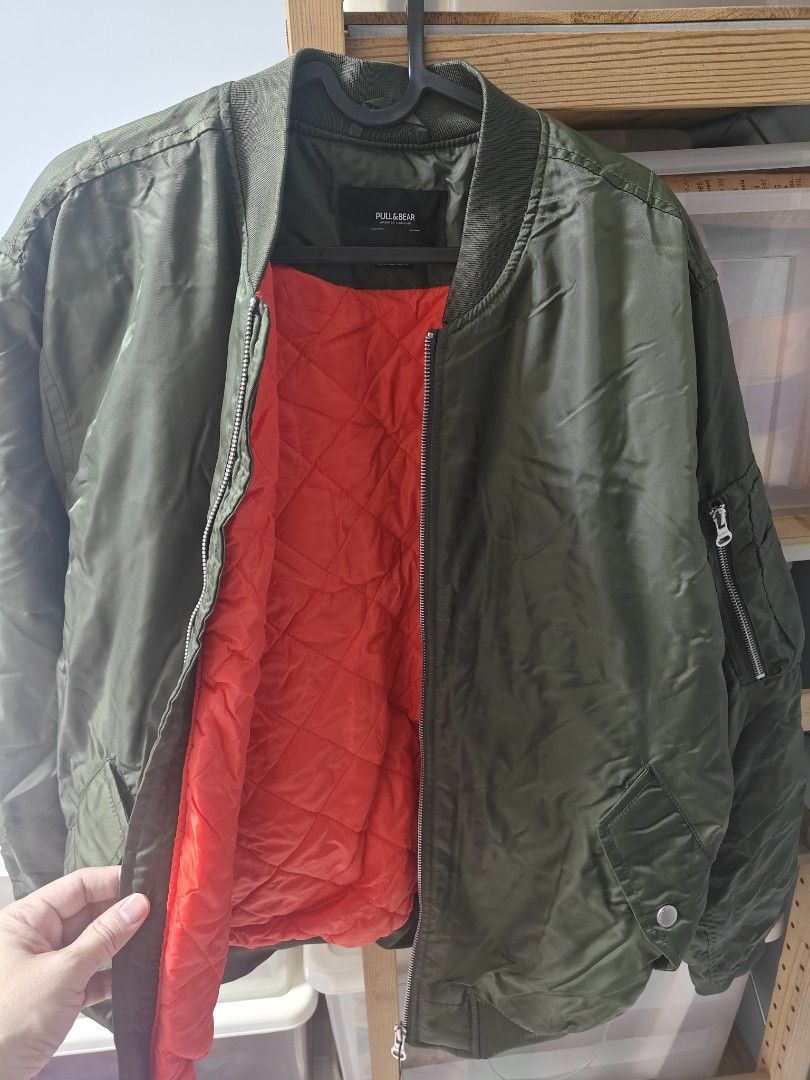 Winter Jacket (Category: Coats, Jackets and Outerwear) located in Singapore. Submitted by tcset (Listing ID 1345596091, Image 3). Description: original brand new green with interior orange..