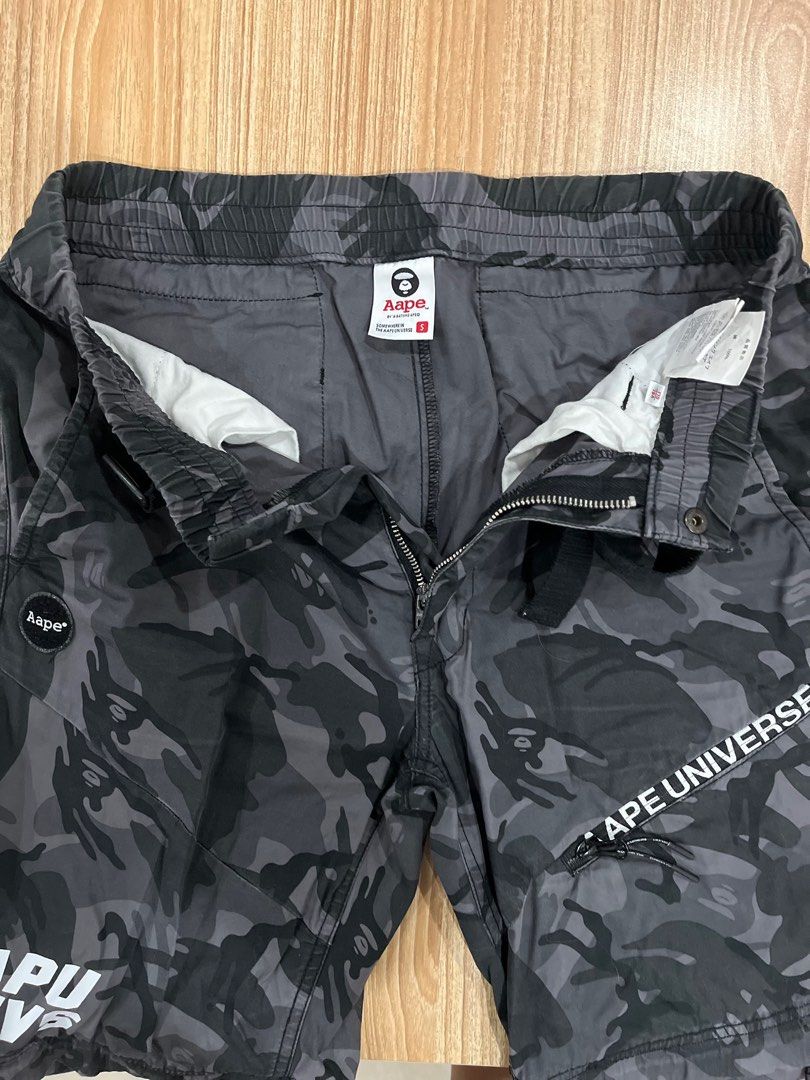 AAPE UNIVERSE BLACK CAMOU Convertible (Category: Joggers) located in Quezon City. Submitted by shemps (Listing ID 1345807719, Image 3). Description: AAPE UNIVERSE BLACK CAMOU Detachable/Convertible Pants *** Small on Tag Color and Condition Rate: 9.8/10 *** Please see detailed pictures .