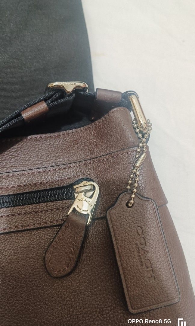 Coach leather sling bag (Category: Luxury Bags & Wallets) located in Paranaque City. Submitted by eyzmartin (Listing ID 1345896513, Image 1). Description: used but still in good condition. check pic. for details.