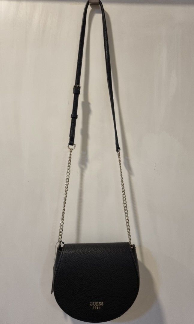 Guess Bag (Category: Cross-body Bags) located in Manila. Submitted by miajoaquin (Listing ID 1345887174, Image 2). Description: GUESS Cate Mini Saddle Crossbody Bag Classic sophistication with a touch of contemporary edge. GUESS's textured saddle bag puts a pop of sleek style in your look. BNWT and bag stuffing but with minor flaw on strap - see last photo..