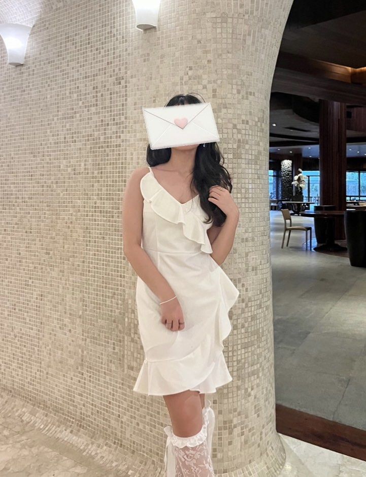 White Ruffled Asymmetrical Wrap Dress (Category: Dresses) located in Manila. Submitted by jiustudio (Listing ID 1308350172, Image 1). Description: worn once good as new material: cotton S-M.