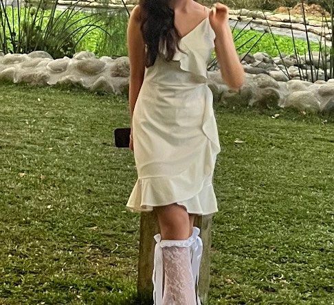 White Ruffled Asymmetrical Wrap Dress (Category: Dresses) located in Manila. Submitted by jiustudio (Listing ID 1308350172, Image 2). Description: worn once good as new material: cotton S-M.