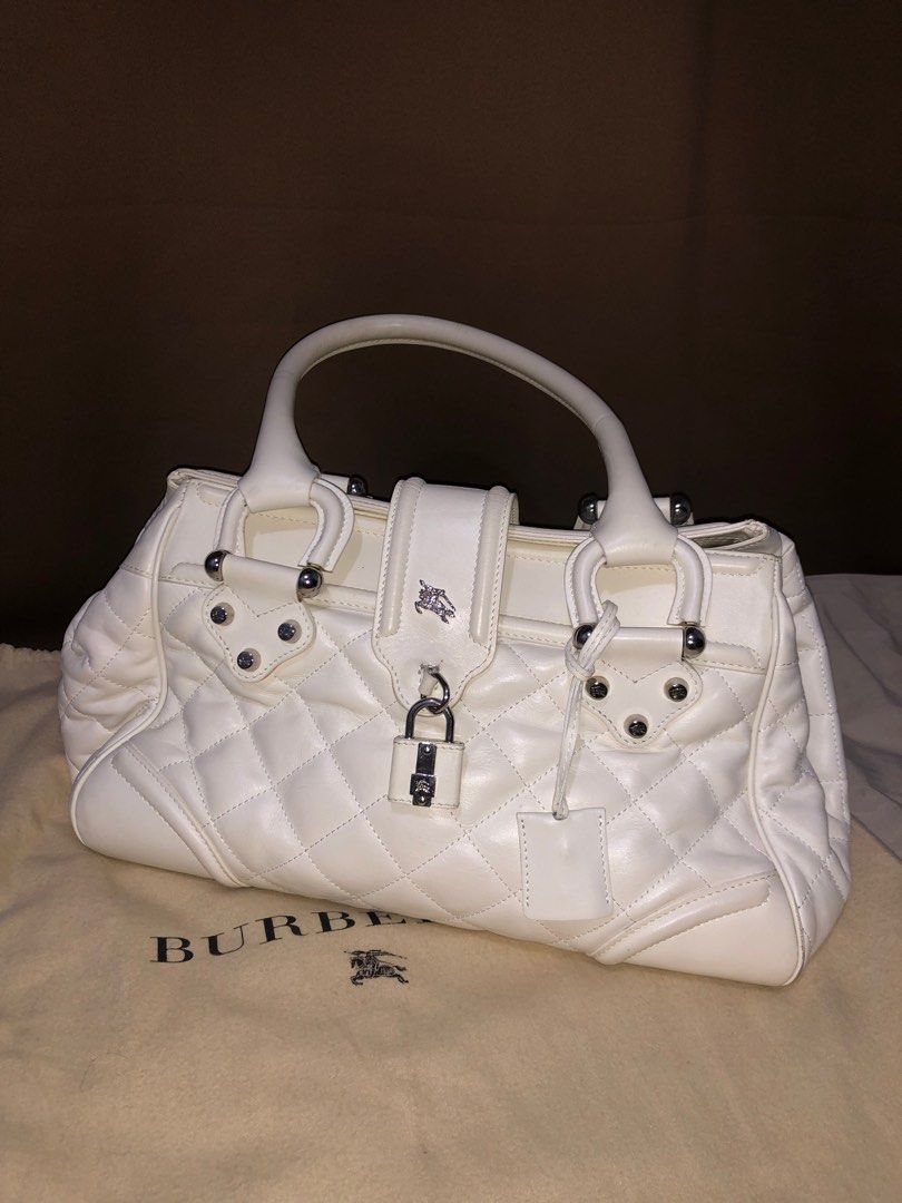 BURBERRY Quilted Leather Calfskin (Category: Luxury Bags & Wallets) located in Pasig City. Submitted by frankiscleaning (Listing ID 1346055074, Image 1). Description: Burberry Matgomery Bag Quilted Leather Calfskin LARGE Manor Bag Tote Purse OFF WHITE Padlock Color: 9/10 Even though it’s white and vintage, this bag has been well taken care of. The strap, color, and overall condition are perfect. It is now considered a luxury vintage item. This is