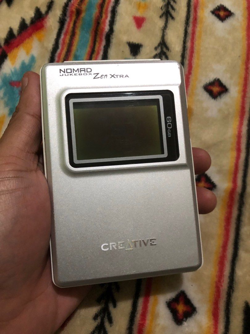 Creative Zen Extra Nomad Jukebox 60gb (Category: Portable Music Players) located in Quezon City. Submitted by markgolveo (Listing ID 1345942273, Image 1). Description: Creative Zen Extra Nomad Jukebox 60gb With power Bad battery easily depletes Bad screen burn can still see some display For parts out repairs.