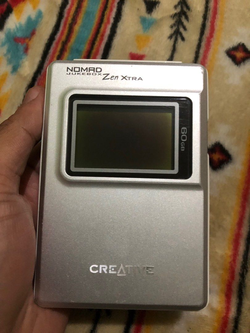 Creative Zen Extra Nomad Jukebox 60gb (Category: Portable Music Players) located in Quezon City. Submitted by markgolveo (Listing ID 1345942273, Image 2). Description: Creative Zen Extra Nomad Jukebox 60gb With power Bad battery easily depletes Bad screen burn can still see some display For parts out repairs.