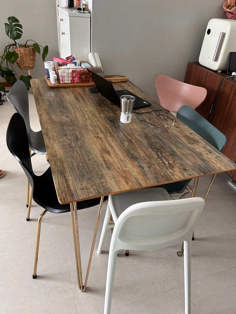 Dining Table (Category: Tables & Sets) located in Singapore. Submitted by poman86 (Listing ID 1345933404, Image 1). Description: solid wooden dining table + 4 chairs 140x80cm remark : ( surface with wooden pattern cover to protect it. it show in picture.. original is black color acrylic solid surface) you can remove the cover anytime. bought $799 3 years ago.