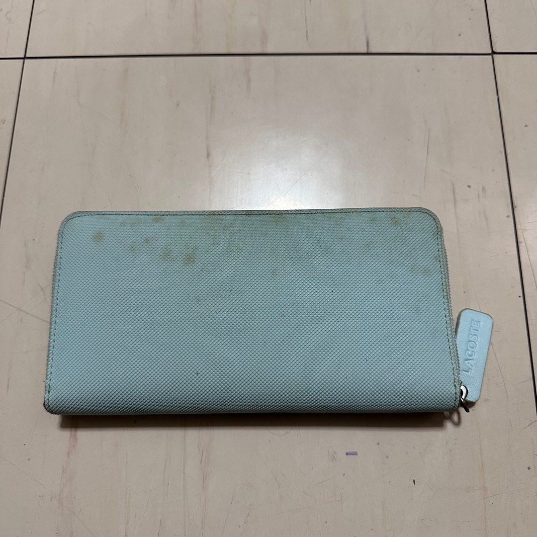 LACOSTE Turquoise Leather Large Wallet (Category: Wallets & Card holders) located in Manila. Submitted by catchim (Listing ID 1346074093, Image 2). Description: Preloved wallet 🩵 •Zip Closure, 12 card slots, and zipped coin compartment Some Issues. GOOD CONDITION •signs of storage (staining - needs deep cleaning) PM for more details!.