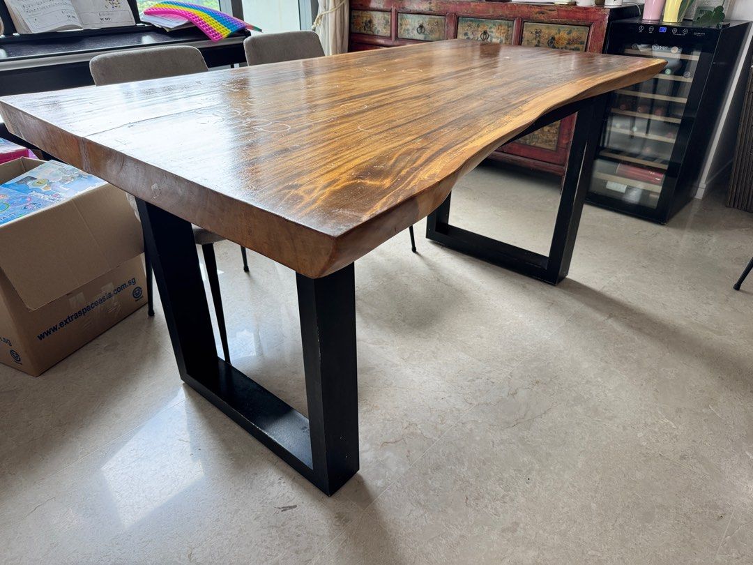 Solid wood Dining Table (Category: Tables & Sets) located in Singapore. Submitted by juicejunkie (Listing ID 1345959927, Image 1). Description: Dining table L160 x D103 (longest part) x 78 (short part) x H 76cm In between2 legs 109cm Solid wood very heavy Table top scratches but can sand and varnish to be new. Free 4 chairs Reluctant sale ! Moving house sale. Bought from reputable vendor Original price more than $3000 Self collect only at 27-29 J