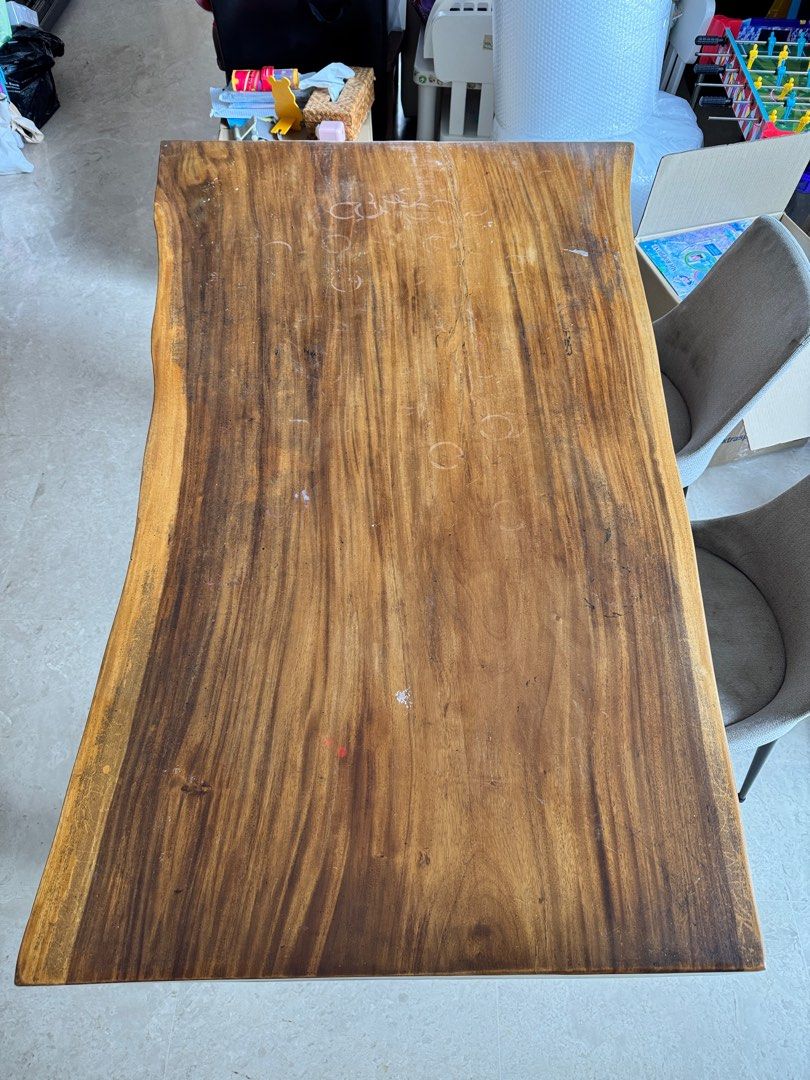 Solid wood Dining Table (Category: Tables & Sets) located in Singapore. Submitted by juicejunkie (Listing ID 1345959927, Image 3). Description: Dining table L160 x D103 (longest part) x 78 (short part) x H 76cm In between2 legs 109cm Solid wood very heavy Table top scratches but can sand and varnish to be new. Free 4 chairs Reluctant sale ! Moving house sale. Bought from reputable vendor Original price more than $3000 Self collect only at 27-29 J
