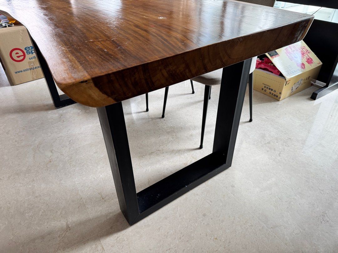 Solid wood Dining Table (Category: Tables & Sets) located in Singapore. Submitted by juicejunkie (Listing ID 1345959927, Image 2). Description: Dining table L160 x D103 (longest part) x 78 (short part) x H 76cm In between2 legs 109cm Solid wood very heavy Table top scratches but can sand and varnish to be new. Free 4 chairs Reluctant sale ! Moving house sale. Bought from reputable vendor Original price more than $3000 Self collect only at 27-29 J