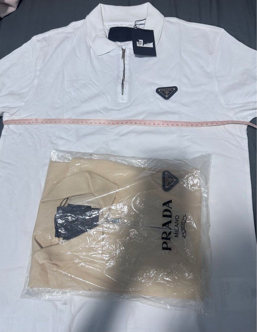 Take All Prada half Zip Up Polo Shirt -2pcs (Category: Tshirts & Polo Shirts ) located in Makati City. Submitted by out_fits (Listing ID 1343793204, Image 3). Description: available White Beige Medium to L frame. .