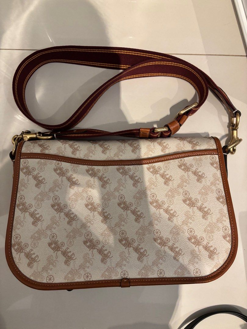 Original Coach bag (Field Messenger Bag With Horse And Carriage Print) (Category: Bags & Wallets) located in Singapore. Submitted by stacy444dance (Listing ID 1346129765, Image 3). Description: Printed coated canvas and polished pebble leather Inside zip and multifunction pockets Magnetic snap closure and fabric lining Outside snap pocket Detachable strap with 54.5cm drop for shoulder or crossbody wear 28.5cm (L) x 20cm (H) x 8cm (W).