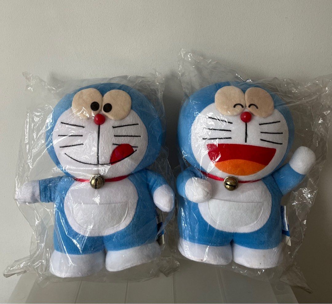 Doraemon (Category: Plushies & Soft Toys) located in Singapore. Submitted by jazcorner (Listing ID 1346223809, Image 1). Description: Big Doraemon (ht about 26cm) - $20 each, both for $36. Small Doraemon (ht about 15.5cm) - $14 each, selling 4 for $50..