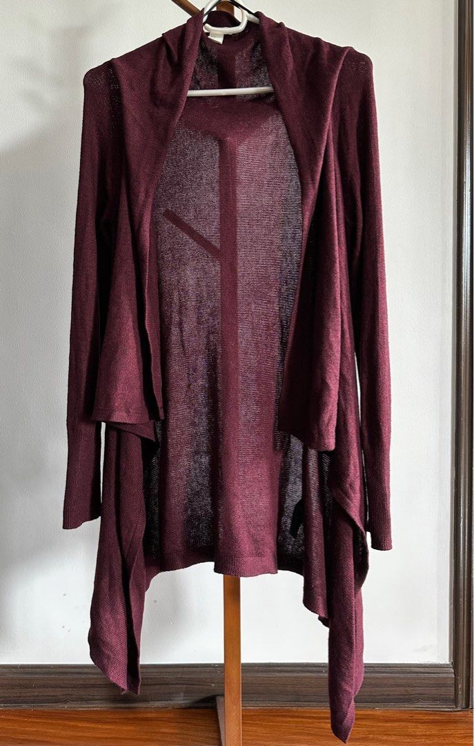 H&M assymetric cardigan (Category: Longsleeves) located in Marikina City. Submitted by samndbx (Listing ID 1346158146, Image 1). Description: Assymetric style Burgundy color Md-length Size M (A bit oversized) .
