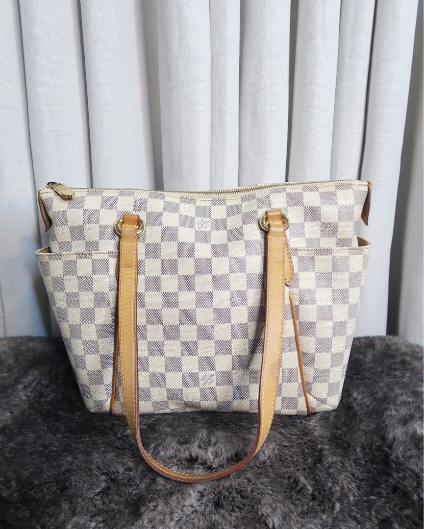 LV Totally Damier Azur (Category: Luxury Bags & Wallets) located in Quezon City. Submitted by theluxurycityph. (Listing ID 1346161809, Image 2). Description: Totally Damier Azur 💛 it comes with 💌 — send us a message for inquiries *color may vary due to lighting* *please review all the photos provided (you can ask for more detailed pictures). the item is sold as is, and all purchases are considered final with NO possibility of exhange or refund.