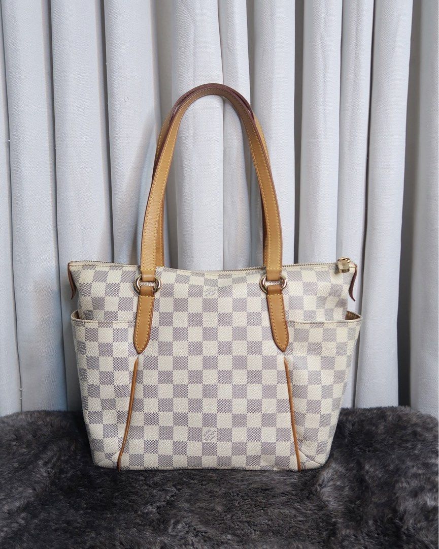 LV Totally Damier Azur (Category: Luxury Bags & Wallets) located in Quezon City. Submitted by theluxurycityph. (Listing ID 1346161809, Image 1). Description: Totally Damier Azur 💛 it comes with 💌 — send us a message for inquiries *color may vary due to lighting* *please review all the photos provided (you can ask for more detailed pictures). the item is sold as is, and all purchases are considered final with NO possibility of exhange or refund.