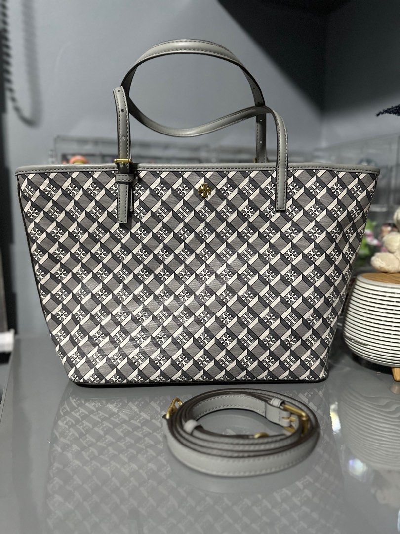 Tory Burch Geo Tote (Gray) (Category: Luxury Bags & Wallets) located in Las Pinas. Submitted by masterjac (Listing ID 1346263509, Image 3). Description: Decluttering. Used once at most twice. Personally purchased from the shops in the U.S. Fixed price MOP: Metrobank / gcash Buyer to book own courier. Location is near Festival mall Alabang. Monday-Thursdays 7:00 AM to 3:00 PM. Thank you .
