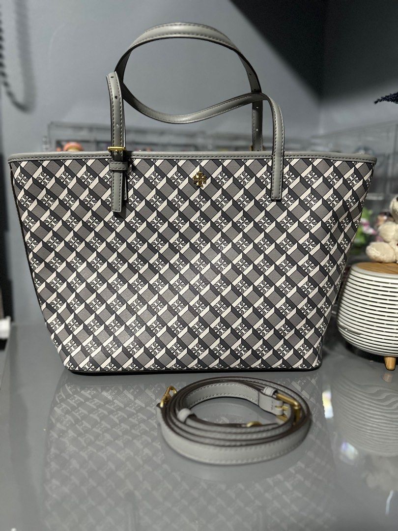 Tory Burch Geo Tote (Gray) (Category: Luxury Bags & Wallets) located in Las Pinas. Submitted by masterjac (Listing ID 1346263509, Image 2). Description: Decluttering. Used once at most twice. Personally purchased from the shops in the U.S. Fixed price MOP: Metrobank / gcash Buyer to book own courier. Location is near Festival mall Alabang. Monday-Thursdays 7:00 AM to 3:00 PM. Thank you .
