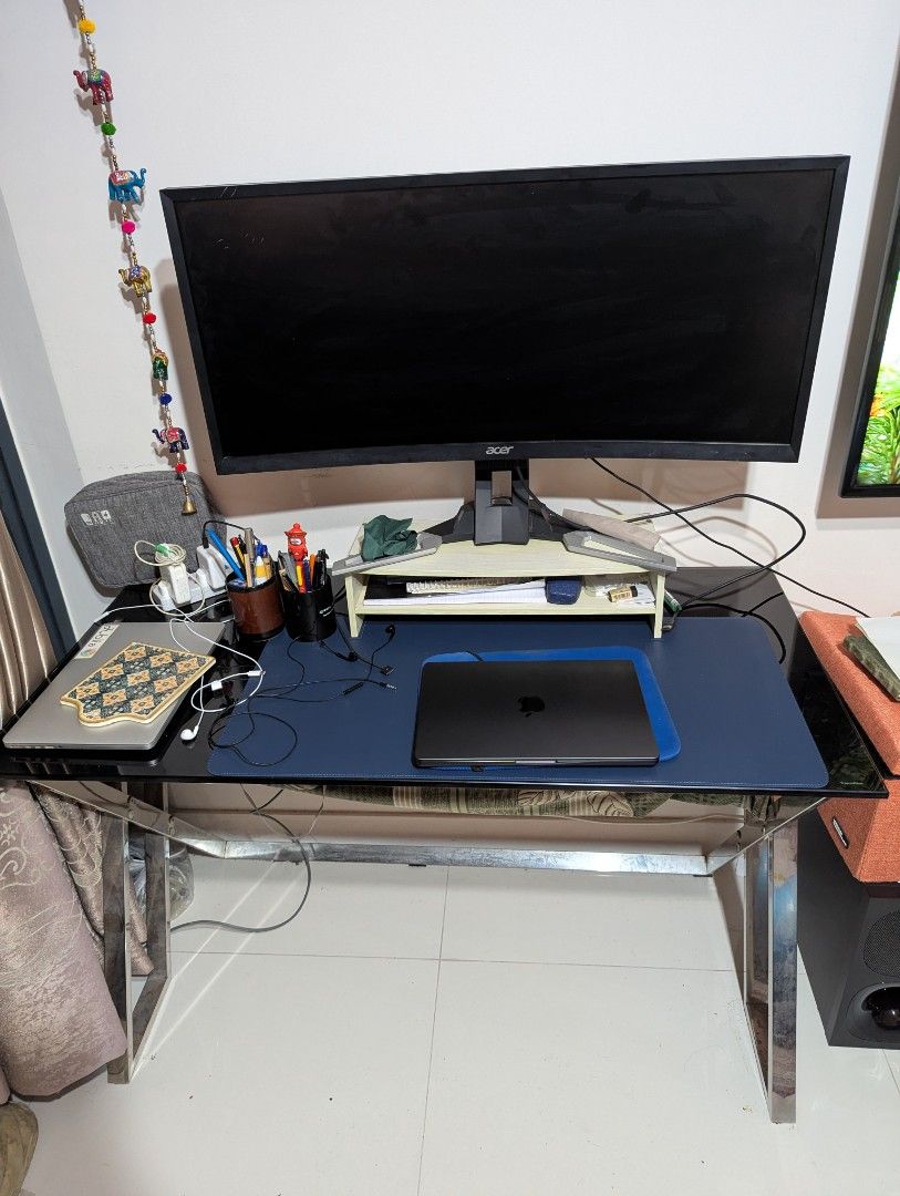 Work table (Category: Tables & Sets) located in Singapore. Submitted by freetree.172ee5 (Listing ID 1346238096, Image 1). Description: Made of tempered glass and steel at the bottom, this table is very study and looks classy. Refer to 3rd photo for slight paint peeling off at the bottom of the glass. L: 116 W: 58 Self pick up and manage your own delivery.