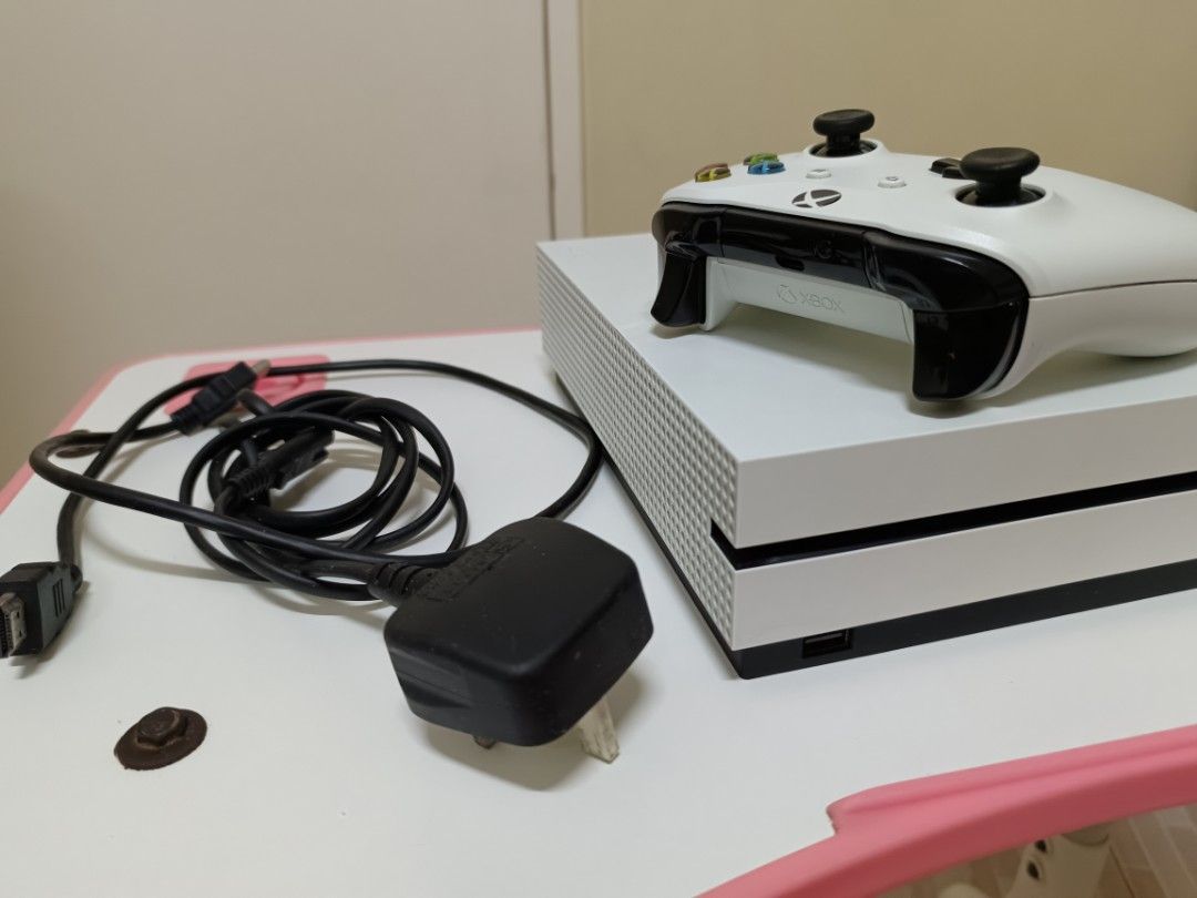 Xbox One S Slim Type (Category: Xbox) located in Manila. Submitted by chinlabrador93555 (Listing ID 1346222146, Image 2). Description: RUSH SALE ✨ Selling my XBOX ONE S slim type, no issues, plug & play, ready to use, with wireless controller, downloaded games (can store up to 500 online downloadable games, use your own account), and with cable & power plug, seldom used since we have Nintendo switch, for pick up thru lalamove or LBC transaction o