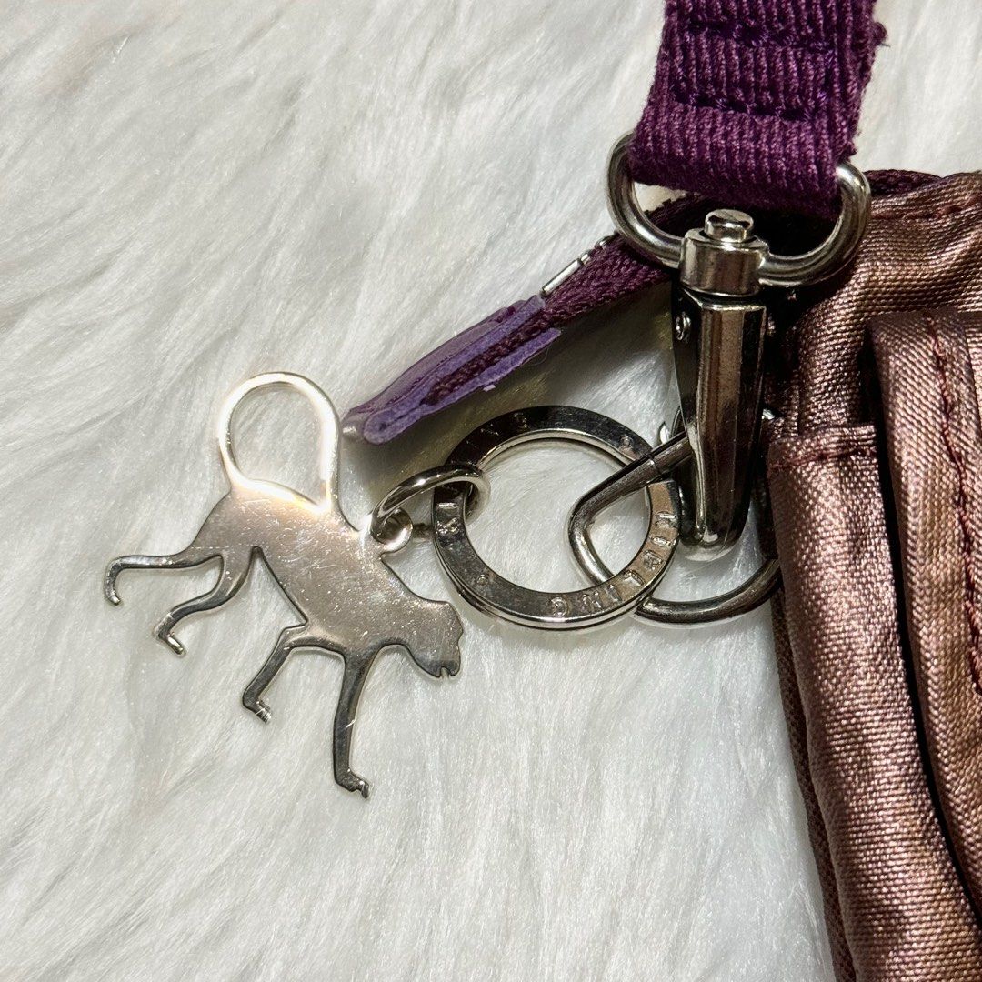 KIPLING Small Metallic Purple Cross-body Bag (Category: Cross-body Bags) located in Manila. Submitted by adoptables4u (Listing ID 1346297459, Image 3). Description: Kipling Cross-body Bag 🦧 - With original kipling tag 🏷️ Please see uploaded imgs for flaws ✨ Product color: Metallic Purple Size (mm): 130 x 230 x 50 Material: Nylon & Polyester 590 yuan SRP feel free to chat for inquiries :) .