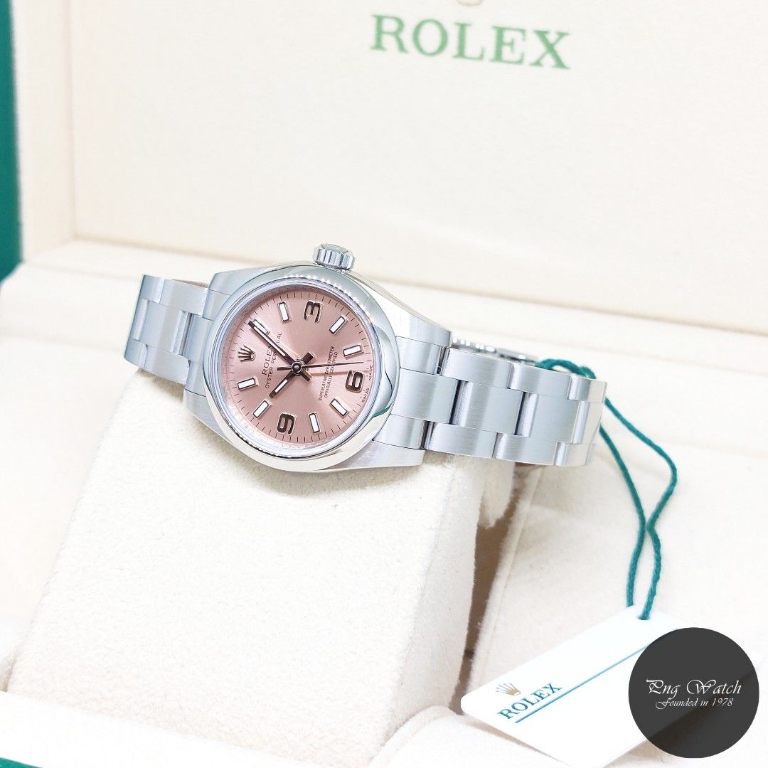Rolex 26mm Pink Arabic Dial Oyster Perpetual REF: 176200 (Box, Card & Tag-2016) (Category: Watches) located in Singapore. Submitted by pngwatchdealer (Listing ID 1346338621, Image 2). Description: [SPECIFICATIONS] **Watch comes in full option (Box, Card & Tag)** Brand: Rolex Model: Oyster Perpetual 26mm Pink Arabic Dial (REF: 176200)(AN)(16)(O) Movement: Automatic (Self-Winding) Functions and Features: Hours, Minutes and Seconds (CASE) Case Mater