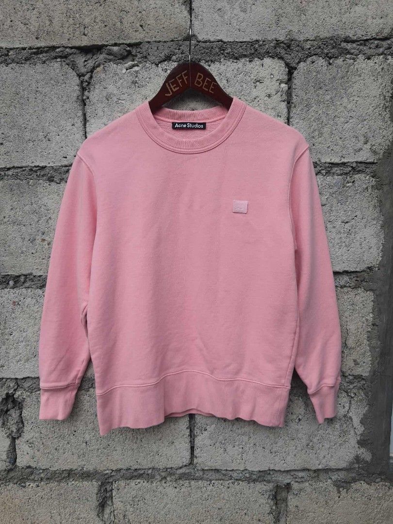 Acne Studios Face Patch Sweatshirt - Pink (Category: Luxury Apparel) located in Bayombong. Submitted by jeffbeeer (Listing ID 1395891957, Image 1). Description: - Authentic Acne Studios sweatshirt - Color: Pink - Size: XS - Iconic face patch detail - Material: 100% Cotton - Made in Portugal - Crew neck and long sleeves - Includes washing instructions on tag.