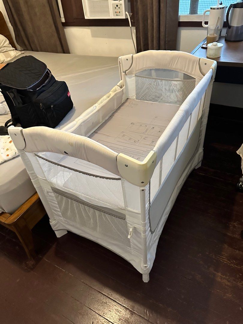 Arm's Reach Ideal Ezee 3 in 1 Co-Sleeper - White (Category: Cots & Cribs) located in Makati City. Submitted by alvino94 (Listing ID 1395847430, Image 1). Description: Selling this used Arm’s Reach Co-Sleeper in a good condition Issues: Missing nylon strap and color is slightly faded Original price: 20,950 Selling price: 8,500 With mattress and fitted sheets and free foam.