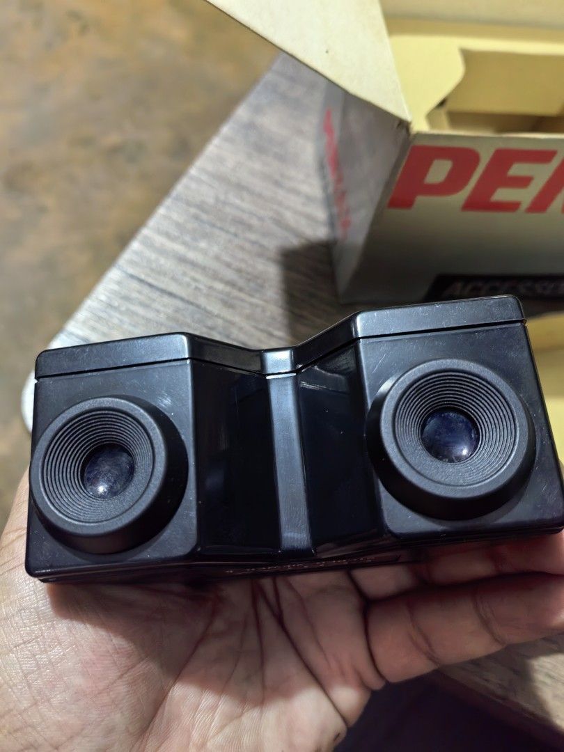 Asahi Pentax Stereo Viewer II (Category: Other Photography Accessories) located in Cebu City. Submitted by dudes_villanueva (Listing ID 1395921203, Image 1). Description: Asahi Pentax Stereo Viewer II Note: Untested. Sold as is. All sales final and non-refundable. 📌This device is a handheld slide viewer designed for the 3D viewing of stereo slide pairs. 📌These stereo slides are typically exposed using a Pentax Stereo Adapter, which fits on cert