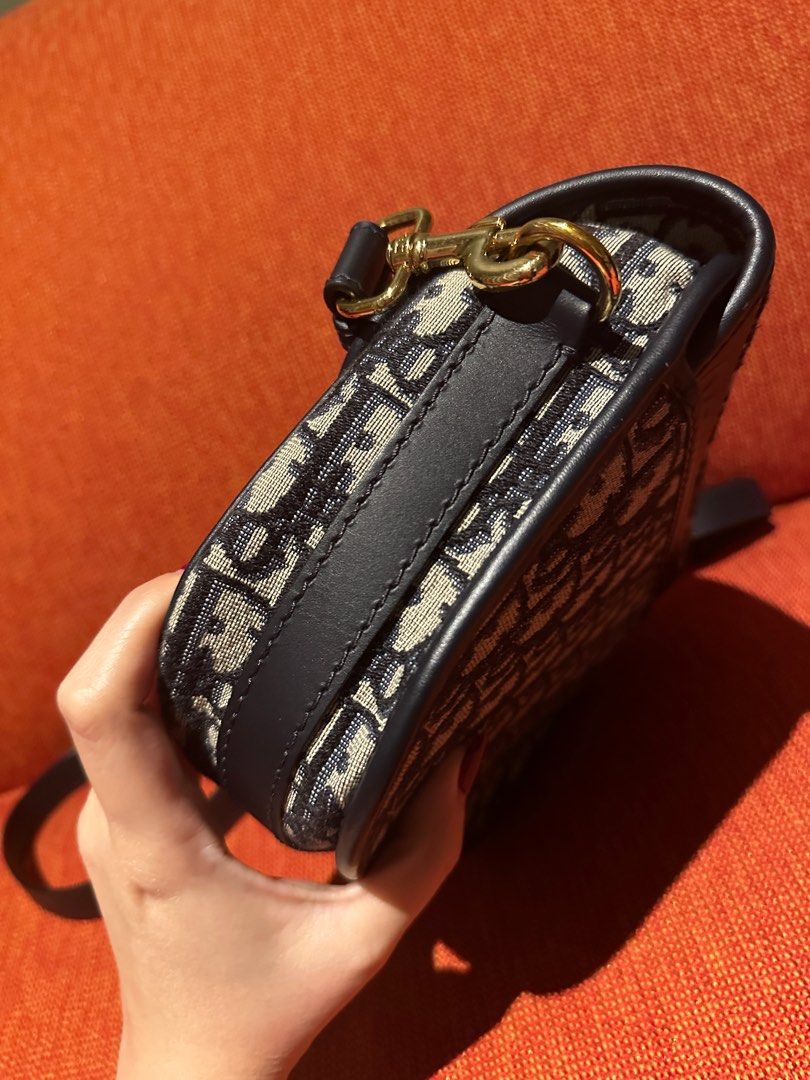 Authentic Dior Bobby Medium size (Category: Luxury Bags & Wallets) located in Paranaque City. Submitted by jomaaaalones (Listing ID 1395883721, Image 3). Description: Selling my preowned dior bobby oblique in medium size. No rubs, no stains on cavanss, just minor scratches on harware buckle with little to no fading. With box and dior dustbag and with cards and store reciept amounting to 217k pesos if converted.