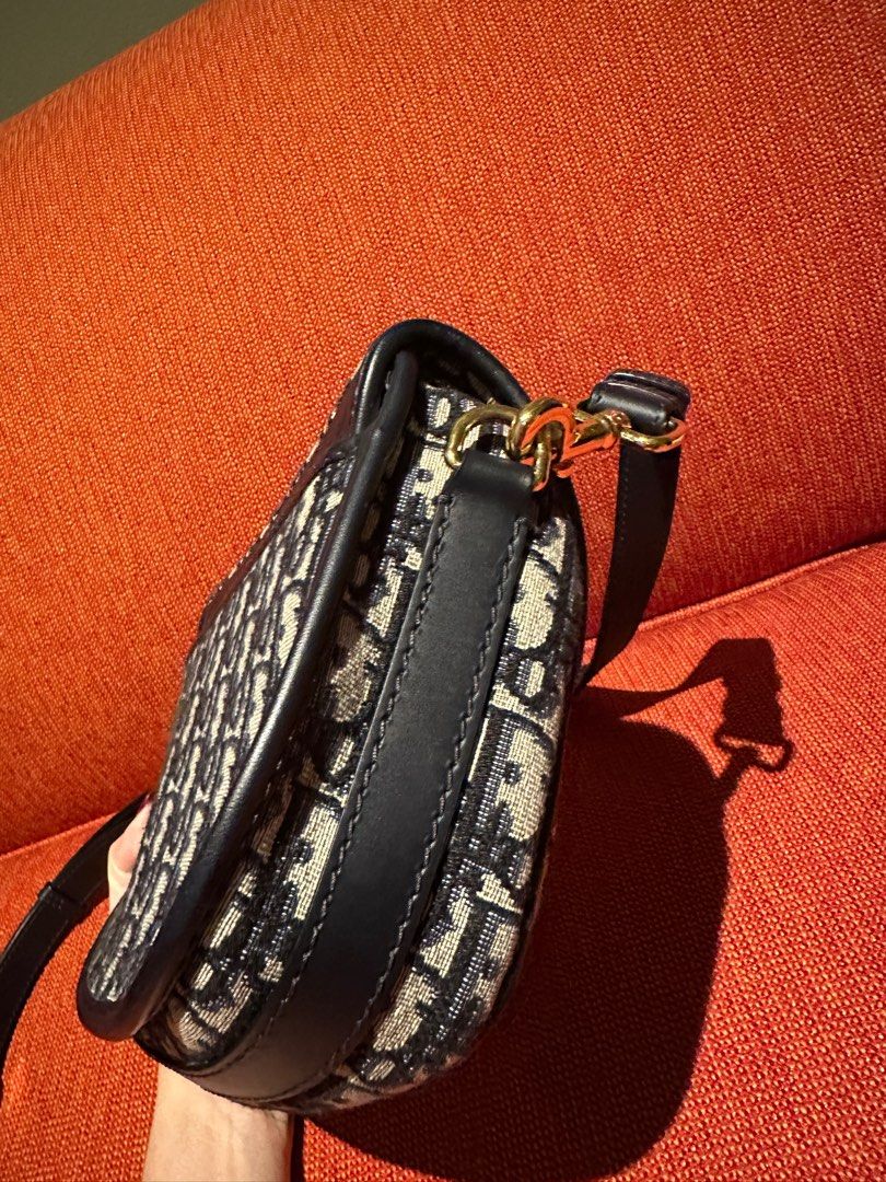 Authentic Dior Bobby Medium size (Category: Luxury Bags & Wallets) located in Paranaque City. Submitted by jomaaaalones (Listing ID 1395883721, Image 2). Description: Selling my preowned dior bobby oblique in medium size. No rubs, no stains on cavanss, just minor scratches on harware buckle with little to no fading. With box and dior dustbag and with cards and store reciept amounting to 217k pesos if converted.