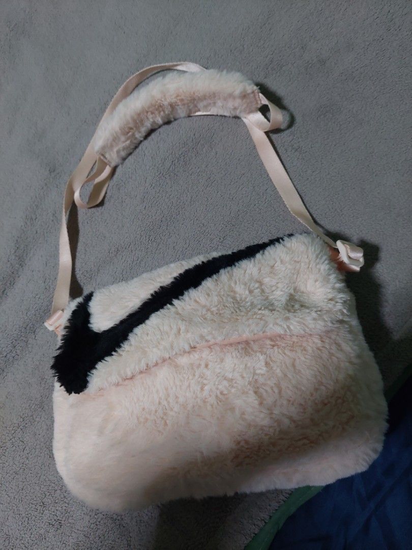 Authentic Nike shoulder bag (Category: Shoulder Bags) located in Paranaque City. Submitted by erick_e (Listing ID 1395838765, Image 1). Description: -Authentic Nike Bag - Salmon pink shoulder bag Can Adjust - Soft, fuzzy exterior Faux Fur - Black check in front - Long strap for comfortable carrying - Used with care -Reason for sell-too many bags -pls chat or sms 0915 727 06 33 -Buy this and get Adidas short and pants for 1900 all 3.